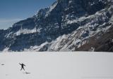 Yvonne jumping in snow below Tukuche Peak