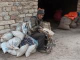 One of our mule drivers fixing a saddle