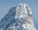 Ama Dablam. Note the three climbers visible above the hanging glacier 