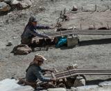 Two women weaving
